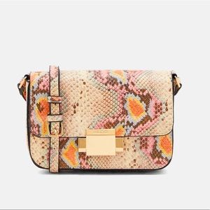 Aldo crossbody bag; snake print.NWT with protective layers still on.